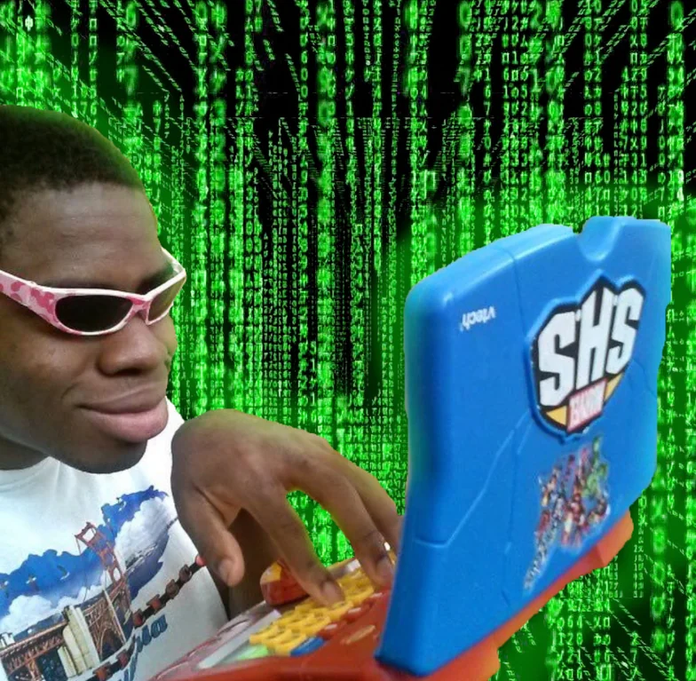 The 'Hackerman' meme: a person in sunglasses typing on a toy laptop against a Matrix-style background of falling green code.